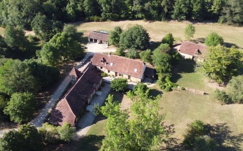 CHARACTERFUL STONE DORDOGNE FARMHOUSE WITH LARGE 4-BED MAIN HOUSE, A LARGE GITE AND ADDITIONAL ACCOMMODATION TO FINISH INTERNALLY. MANY OUTBUILDGNS. 15 HECTARES OF LAND, STREAM, PONDS & WOODS. DEP0735