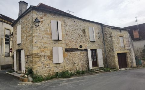Maison en pierre de village avec jardin et garage